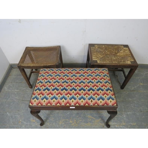 819 - An antique mahogany duet stool, recovered in multicoloured woollen material, on cabriole supports. T... 