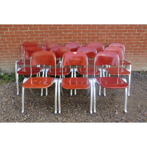 820 - A set of 12 mid-century aluminium and plywood stacking chairs by Joan Casas Ortinez for Indecasa Spa... 