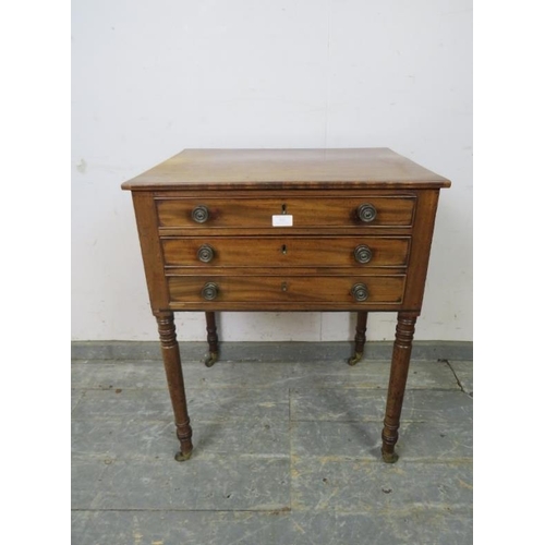 822 - A Georgian mahogany writing table, housing two long cock-beaded drawers with adjustable writing slop... 