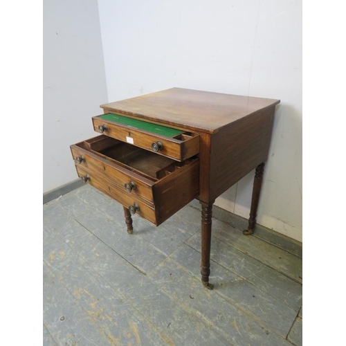 822 - A Georgian mahogany writing table, housing two long cock-beaded drawers with adjustable writing slop... 