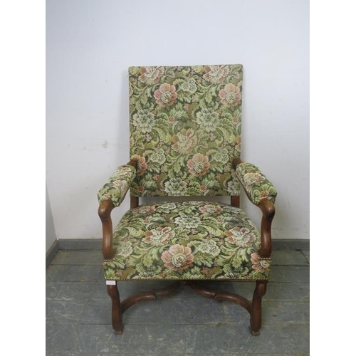 823 - An antique walnut open-sided armchair in the William & Mary taste, upholstered in tapestry material,... 