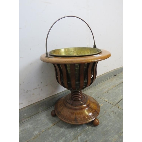 825 - A 19th century mahogany Dutch tea bucket/planter, strung with satinwood, on a turned column terminat... 