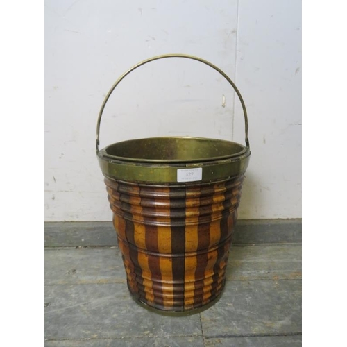 827 - A 19th century Dutch peat bucket, having sectioned mahogany, walnut and maple sides with brass bandi... 