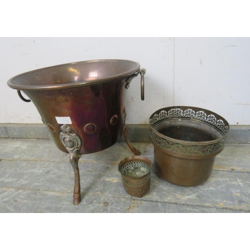 828 - A 19th century copper planter, with drop-ring handles and repousse roundel decoration, on hoof feet.... 