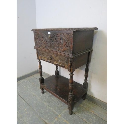 833 - A 17th century oak bible box on stand, having lunette carving to front, the stand with single drawer... 