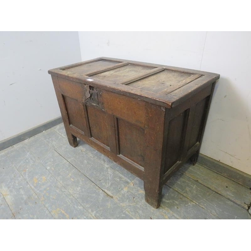 836 - An early 18th century oak panelled coffer of small proportions, on stile supports. 
H63cm W93cm D50c... 