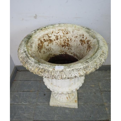 841 - An antique cast iron campana urn painted white, on a plinth base. 
H72cm W58cm (approx).
Condition r... 