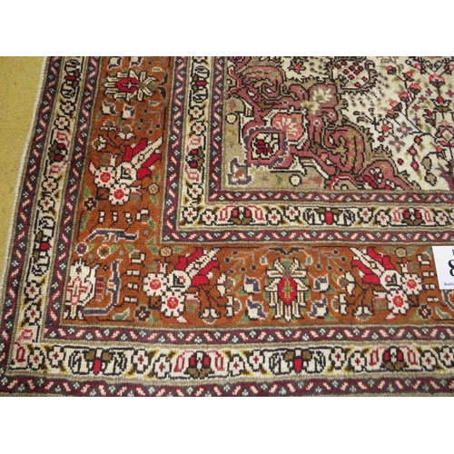 857 - A Northwest Persian Tabriz rug.  Cream, brown and splashes of red.  182cm x 148cm.
Condition report:... 