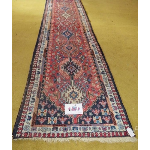 861 - A good early-mid 20th Century Persian runner, ten central linked motifs on red ground. 295cm x 60cm.... 