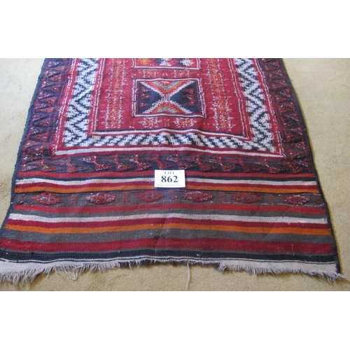 862 - A mid 20th Century Persian Kilim red/cream/black with central motifs. 213cm x 114cm approx.
Conditio... 