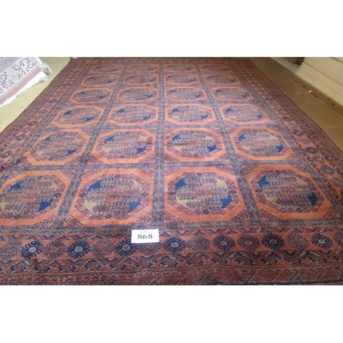 868 - A large early-mid 20th Century Afghan carpet with central block repeat pattern on brown ground. 320c... 