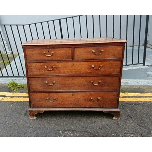 750A - A George III oak and mahogany crossbanded chest, housing two short over three long graduated cock-be... 