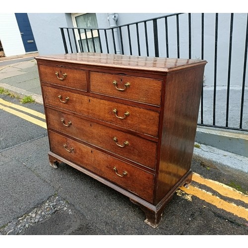 750A - A George III oak and mahogany crossbanded chest, housing two short over three long graduated cock-be... 