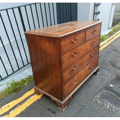 750A - A George III oak and mahogany crossbanded chest, housing two short over three long graduated cock-be... 