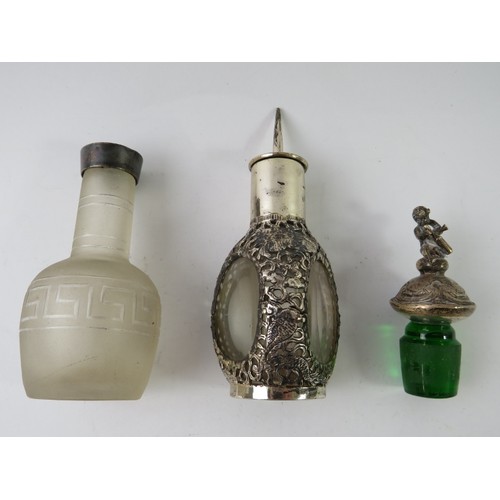 374 - A Chinese white metal mounted glass perfume bottle, a silver mounted glass pounce pot with Greek key... 