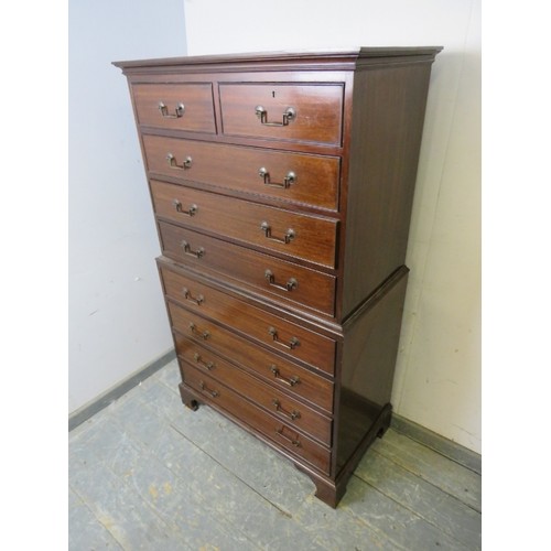 760A - An antique mahogany chest on chest, housing two short and seven long cock-beaded drawers with archit... 