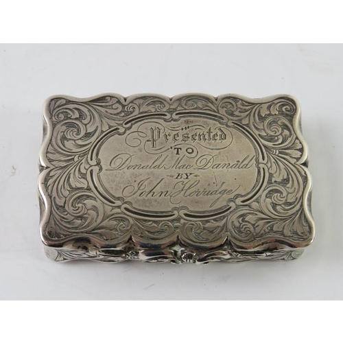 363 - A mid 19th century silver snuff box with overall foliate engraved decoration. Hallmarked for Birming... 