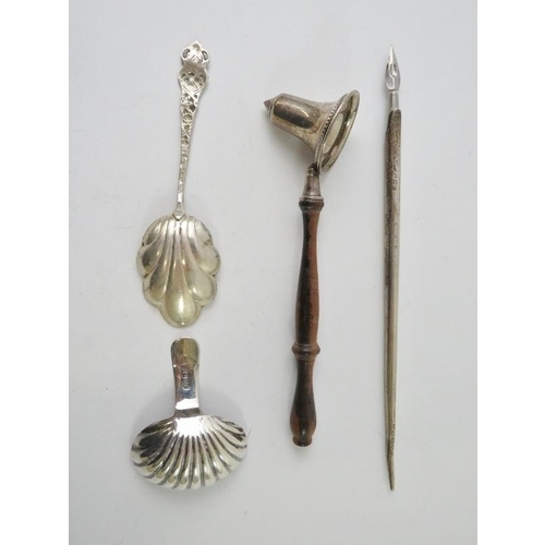 430 - A George III silver caddy spoon with fluted bowl, a silver bodied quill pen, a silver mounted candle... 