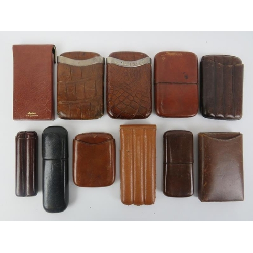 110 - Eleven vintage and antique leather cigar cases. Two with sterling silver mounts. (11 items) 16.2 cm ... 