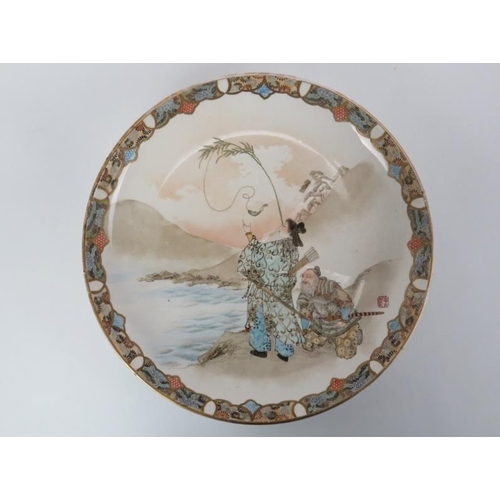 12 - A Japanese kutani ware plate, Meiji Period (1868–1912). Finely decorated depicting a scene of two sa... 