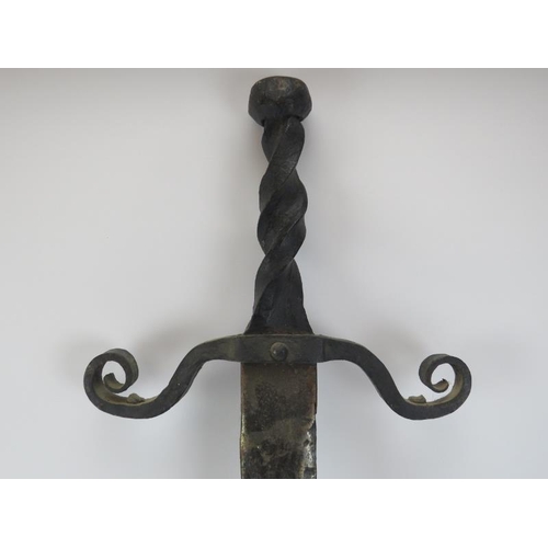 128 - A large wrought iron and steel Medieval style sword, 20th century. 99 cm length.
Condition report: S... 