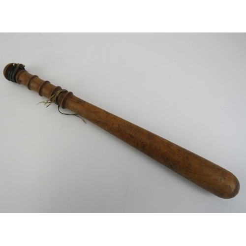 130 - A turned fruitwood truncheon, 19th century. 41.3 cm length. 
Condition report: Handle with splits an... 