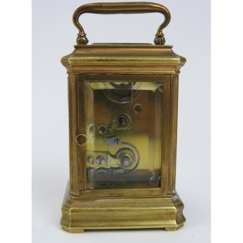 134 - A miniature enamel and brass travelling carriage clock, late 19th/early 20th century. 9.2 cm height.... 