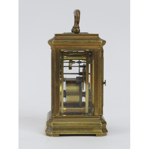 134 - A miniature enamel and brass travelling carriage clock, late 19th/early 20th century. 9.2 cm height.... 