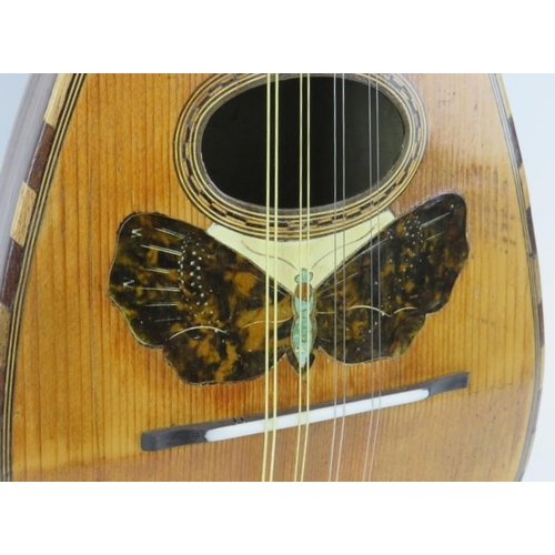 137 - A vintage eight stringed mandolin, 20th century. Parquetry inlaid with a variety of woods throughout... 