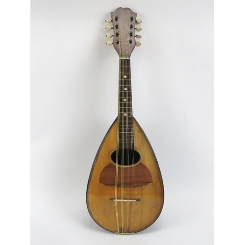 138 - A vintage Italian eight stringed mandolin, 20th century. Inlaid with a variety of woods throughout i... 