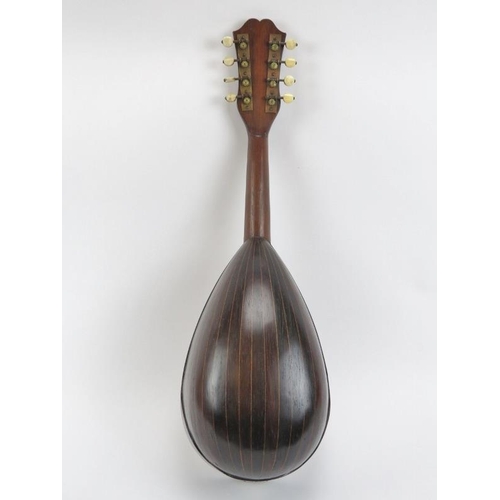 138 - A vintage Italian eight stringed mandolin, 20th century. Inlaid with a variety of woods throughout i... 