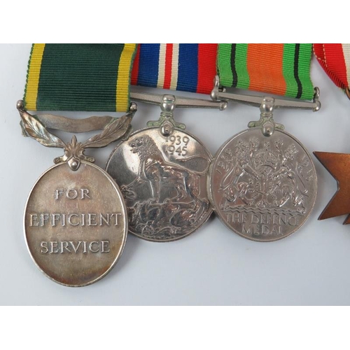 157 - A British WWII group of six medals. Comprising the The 1939 - 1945 Star, The Africa Star, The Italy ... 