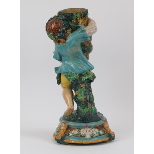 197 - A large majolica table lamp base modelled with a Bacchanalian figure holding a cornucopia, 19th cent... 