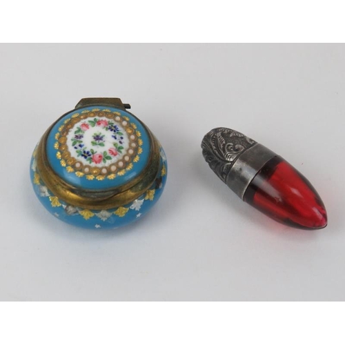 207 - A Victorian silver and cranberry glass smelling salts/scent bottle together with an enamelled and gi... 