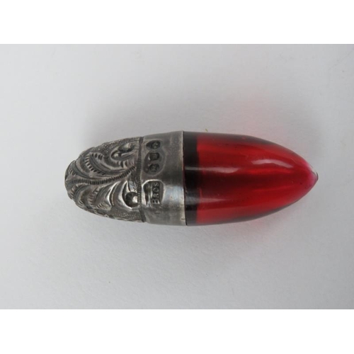 207 - A Victorian silver and cranberry glass smelling salts/scent bottle together with an enamelled and gi... 