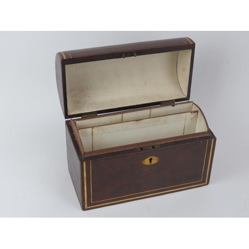 214 - A gilt tooled leather dome topped stationery box, late 19th/early 20th century. With compartmented i... 