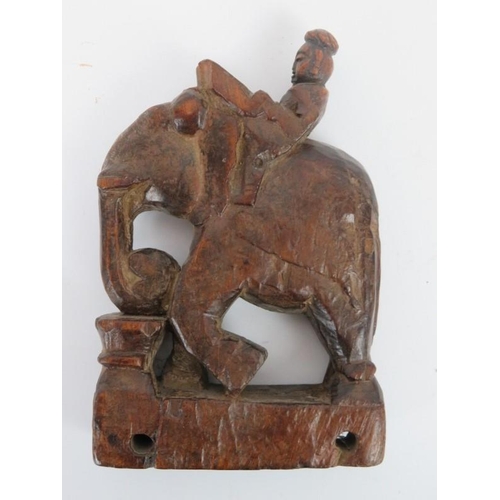 233 - An Indian carved wood figure on an elephant and a Chinese carved and lacquered wood figural carving,... 