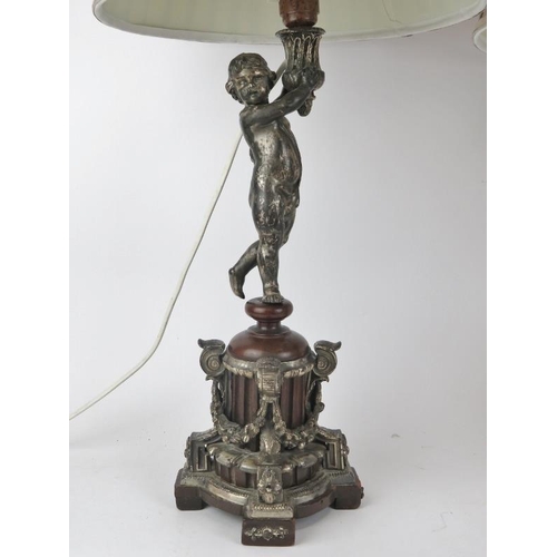 236 - A pair of Neoclassical putti table lamps, late19th/early 20th century. Constructed in plated metal, ... 