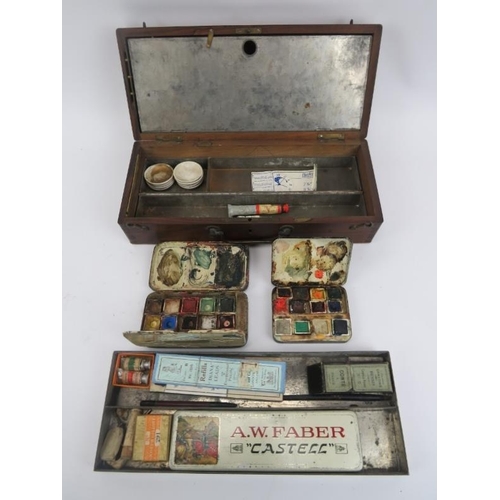 24 - An antique artists travel paintbox, late 19th/early 20th century. With compartmented interior and a ... 