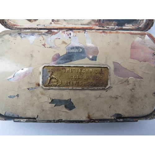 24 - An antique artists travel paintbox, late 19th/early 20th century. With compartmented interior and a ... 