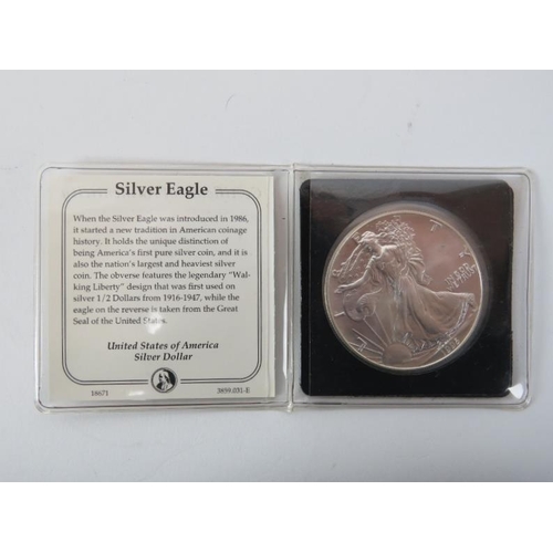 257 - A group of United States of America silver dollars, dimes and a commemorative coin, 19th/20th centur... 