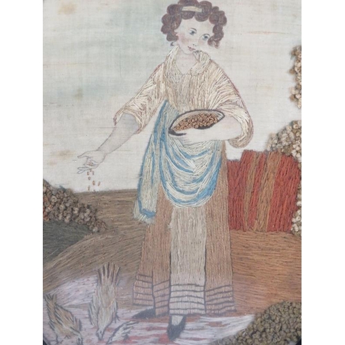 26 - A Georgian figural silkwork panel, dated 1826. Of oval form, depicting a female figure feeding chick... 