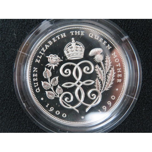 268 - Three Royal Mint commemorative sterling silver crowns and a 2000 Millennium silver five pound coin. ... 