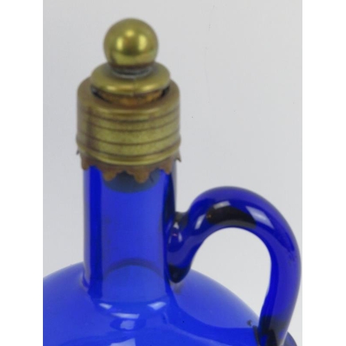 36 - Two Bristol blue glass spirit decanters with stoppers, 19th century. Of flagon form with brass mount... 