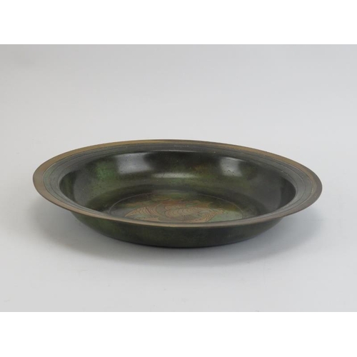 44 - A vintage Danish brass inlaid bronze verdi gris bowl. Decorated with a sailing ship to the centre. 2... 