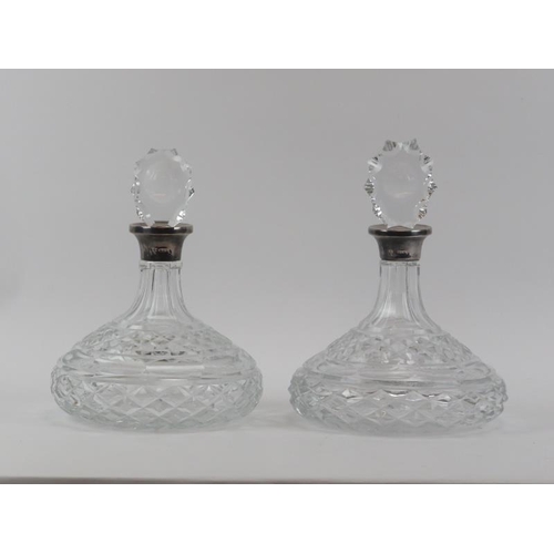 45 - Two silver mounted Brierley glass decanters with stoppers. Collars mark of ERS, London 1977. (2 item... 