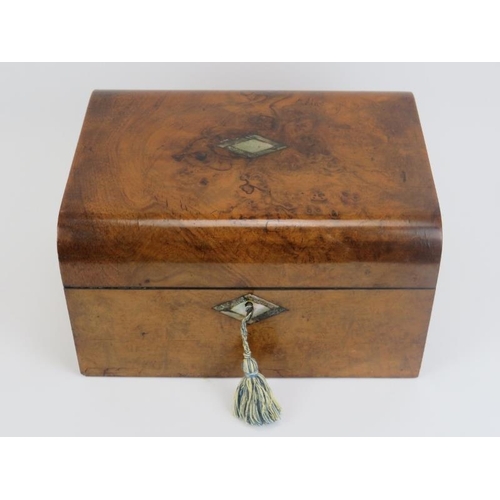 5 - A late Victorian burr walnut travelling vanity box. The gilt tooled leather and velvet compartmented... 