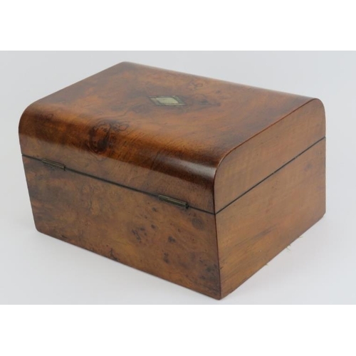 5 - A late Victorian burr walnut travelling vanity box. The gilt tooled leather and velvet compartmented... 