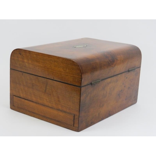 5 - A late Victorian burr walnut travelling vanity box. The gilt tooled leather and velvet compartmented... 