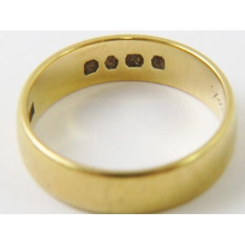 506 - An 18ct yellow gold wedding band; and a 22ct yellow gold wedding band (cut), 10.3gms gross.